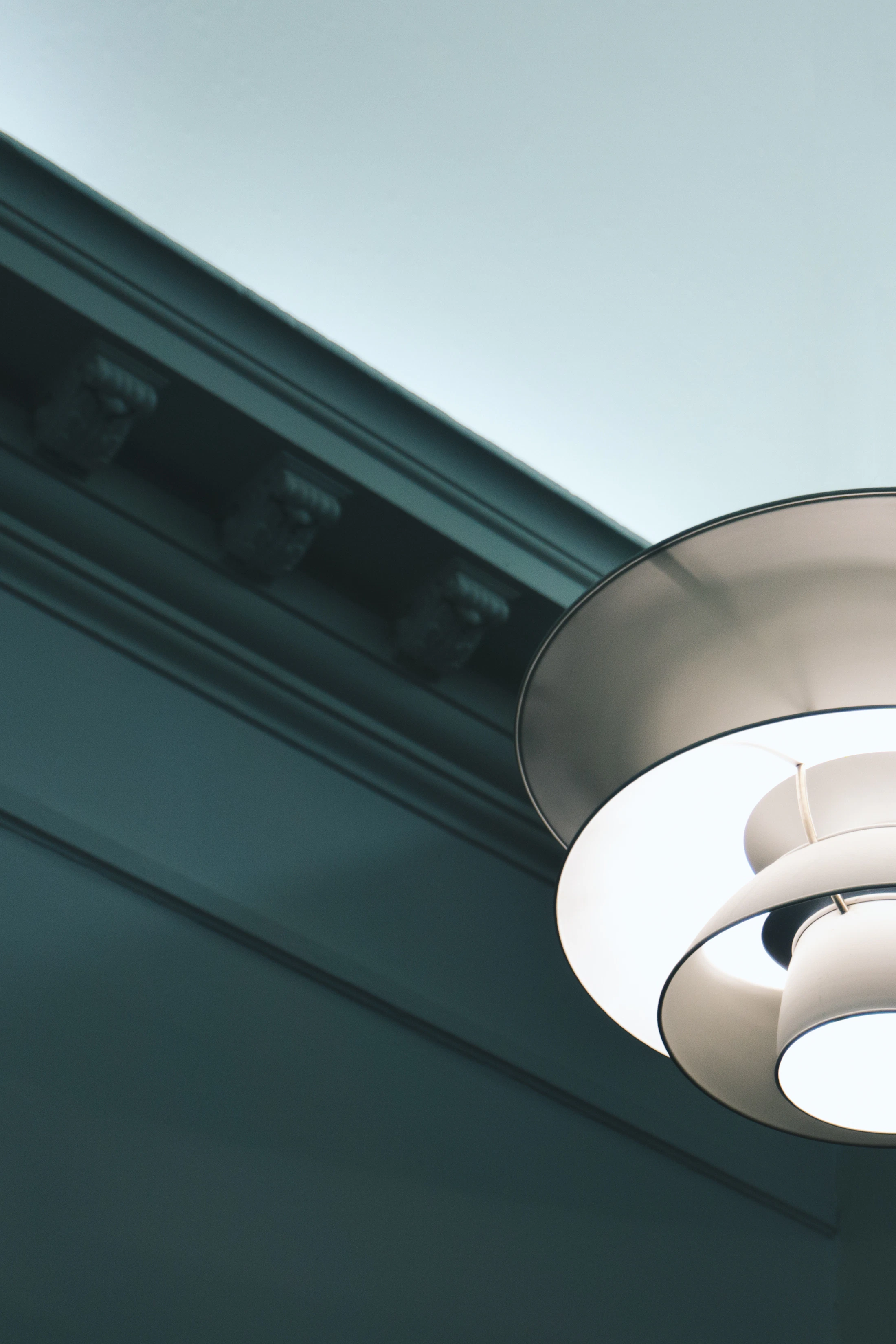 White pendant luminaire in a carefully lit interior